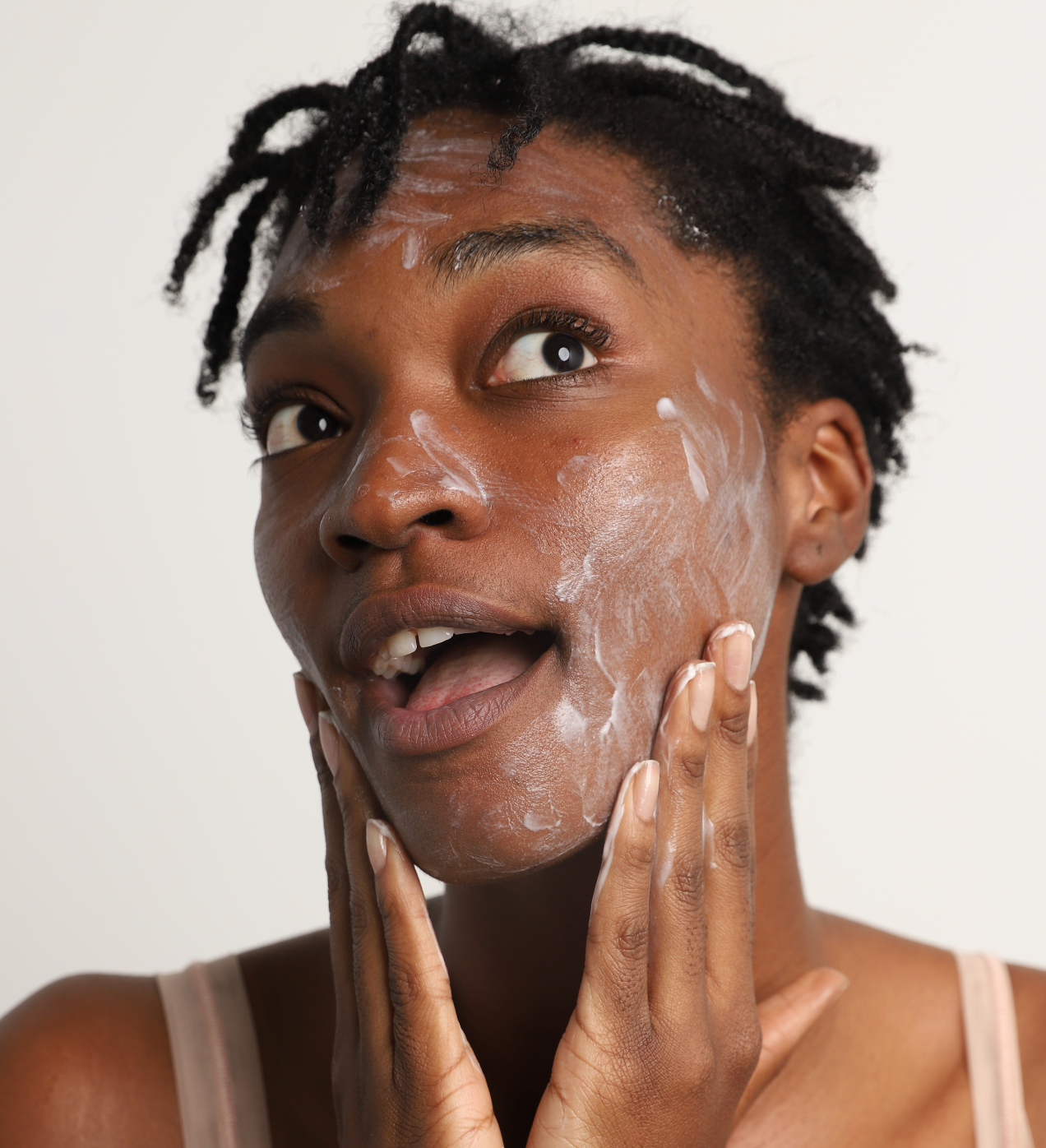 corrective green tea cleanser on face