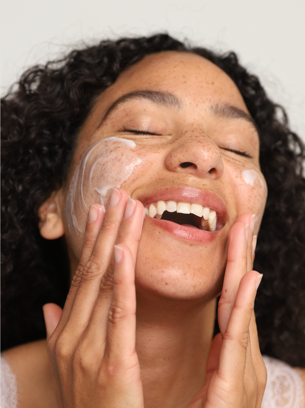 corrective green tea cleanser on face