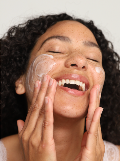 corrective green tea cleanser on face